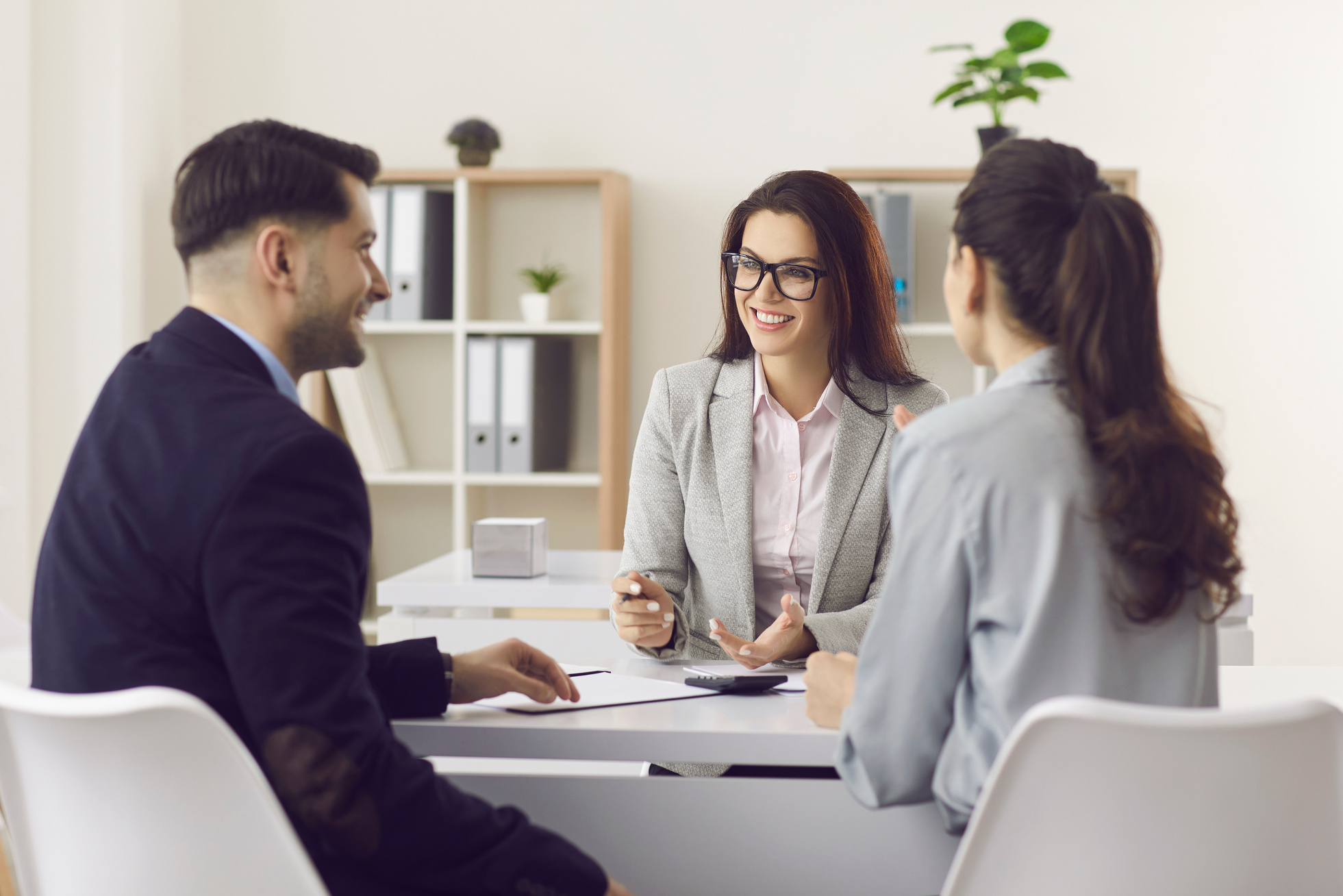 Woman Financial Advisor Giving Consultation to Family Couple about Buying House